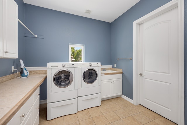 a blue laundry room with a side-by-side washer and dryer
